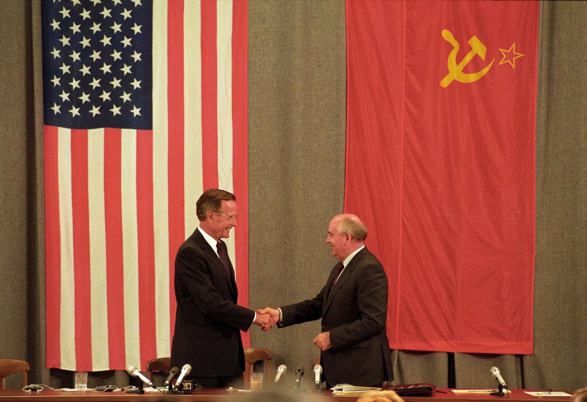 U.S. President George H. W. Bush and Soviet leader Mikhail Gorbachev shake hands after holding a press conference in Moscow on July 31, 1991